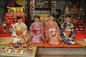Kimono clad staff with hina dolls